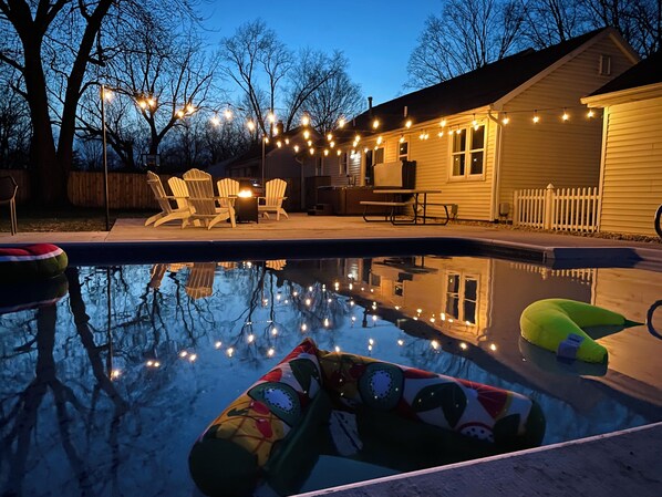 Enjoy the ultimate relaxation with poolside vibes, a soothing hot tub, and a cozy fire pit. Whether you're playing backyard games, grilling your favorite meal, or just lounging under the twinkling lights, this space is your perfect escape for a wonderful retreat.