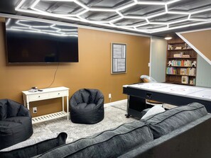 Fun for the whole family! Play pool, ping pong, or air hockey, and dive into hours of entertainment with the Infinity Game Table and arcade classics. Kick back in the comfy bean bags, challenge your friends to Giant Connect 4, or get nostalgic with SNES. Plus, there’s a cozy book nook for quiet moments after the action!