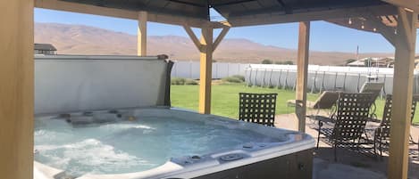 New back patio with gazebo covered hot tub. Relax and enjoy the Mountain View. 