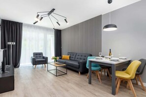 The elegant living room featuring a comfortable sofa perfect for relaxation.