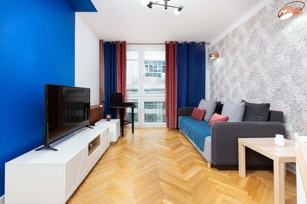 Living room with a comfortable sofa and TV. 
