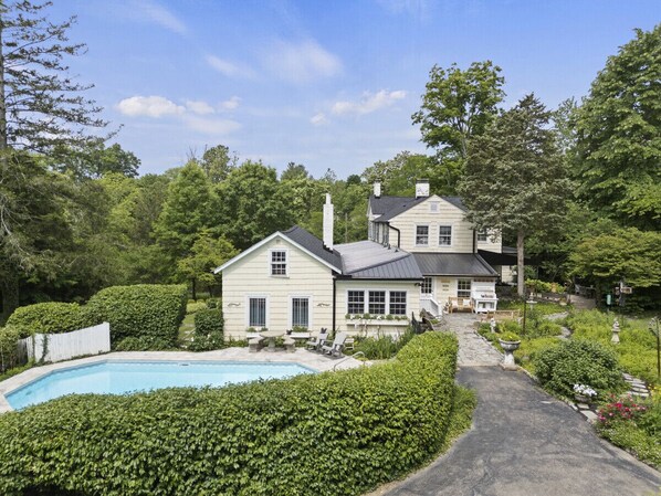 Private Pool, hedges, back of house.