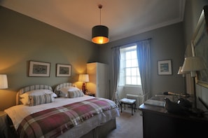 King bedded bedroom,  facing north-east; cool in summer & warm in winter.
