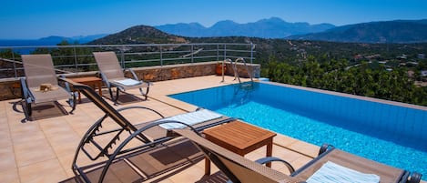 Enjoy views of the Aegean and the Cretan mountains from your infinity pool