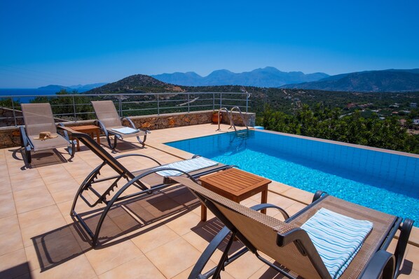 Enjoy views of the Aegean and the Cretan mountains from your infinity pool