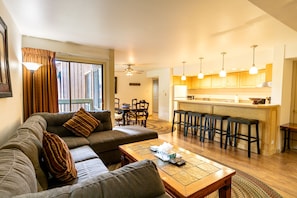 The living area features a wood burning fireplace and a flat screen TV.