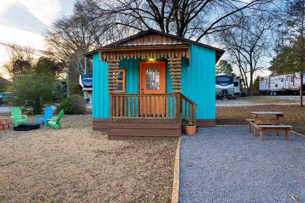 Fire pit area with Adirondack chairs and picnic table