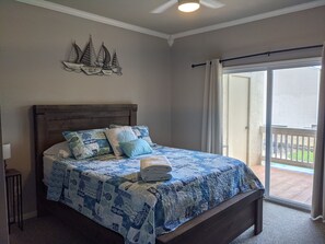 Queen bed with private bathroom and balcony