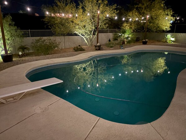 Nighttime Retreat: Splash under twinkling lights in your private oasis, perfect for evening relaxation!