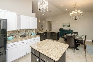 Kitchen: Elegant design meets functionality with stylish islands and stunning lighting!