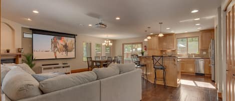 Living area with comfy sofa and theater projection