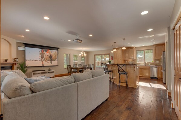 Living area with comfy sofa and theater projection