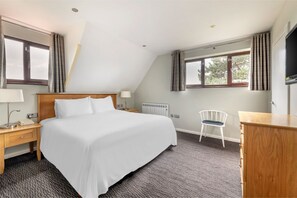 Spacious bedroom with clean lines and a calming color palette.