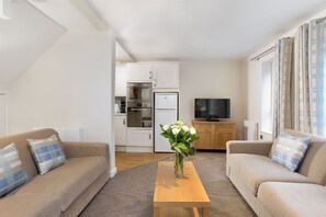 Modern living area with comfortable seating and tasteful décor.