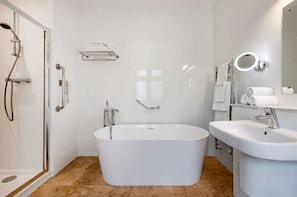 Spacious bathroom with standalone tub for a relaxing soak.