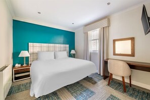 Bedroom with a calming color palette and comfortable bedding for a tranquil rest.