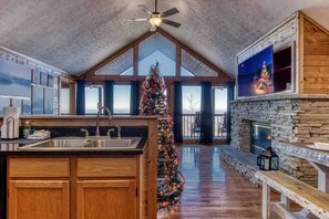 Open kitchen and living room with views to the back deck.