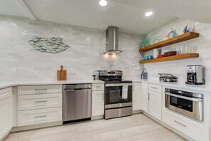 New appliances, fully stocked kitchen with utensils, pots/pans, etc.