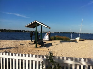 Wedding in front of the patio area. The setting draws many for photos.