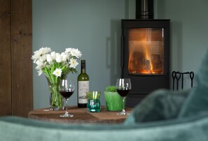 Settle down in front of the wood burning stove on cooler days