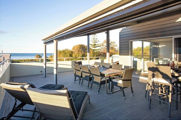 Kick back on the sun loungers or gather on the spacious, partly covered terrace, with direct access to the primary suite.
