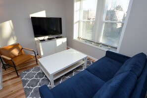 Living Room With 55" 4K Smart TV, Cable And DVD Player
