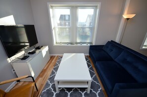 Living Room With 55" 4K Smart TV, Cable And DVD Player