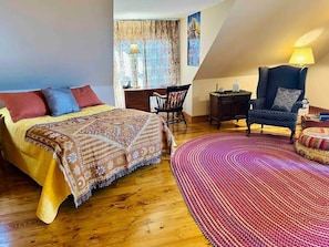 Master bedroom on 2nd floor has two queen beds, desk, dinnette table, kitchenette, and work desk.