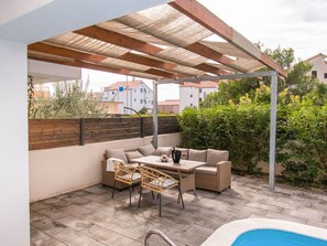 Plant, Furniture, Property, Table, Shade, Outdoor Furniture, Interior Design, Cloud, Houseplant, Chair