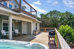 Lower deck with hot tub and charcoal grill