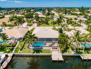 Aerial view back of the home on canal