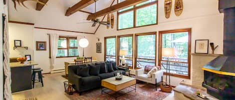 Wide angle photo of the main room, perfect cozy cabin setting for wooded retreat