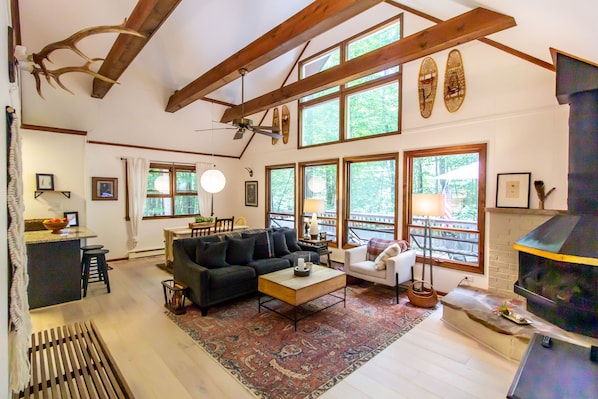 Wide angle photo of the main room, perfect cozy cabin setting for wooded retreat