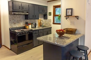 Rustic, open kitchen fully equipped with all your conveniences