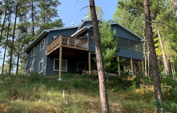 Perched on a hill, this lovely house looks out over beautiful Lake Nancy.