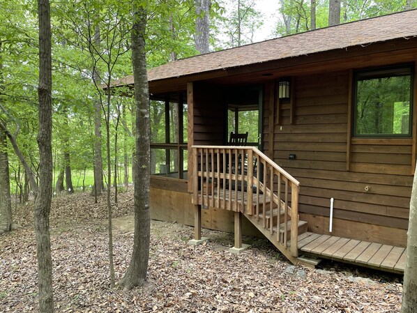 Cabin front door during the Spring and Summer when trees are in bloom