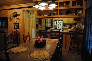 Our dining area offers lots of room at the farmhouse table or bar.