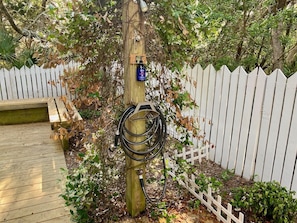 Outdoor shower includes shampoo to wash your dog outside.