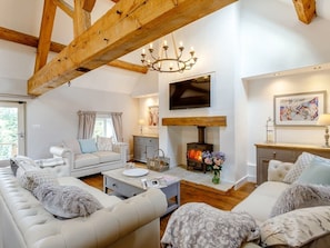 Lounge with log burner and three sofas