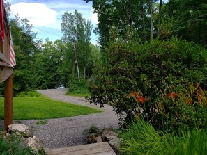 Front steps to driveway, lake access across the street.