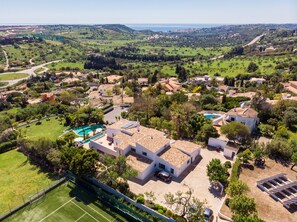 Ariel view of the property looking out to the surrounding golf courses and sea.