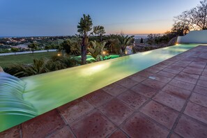 Top patio off the open plan living space. Sunset views of Praia da Luz.