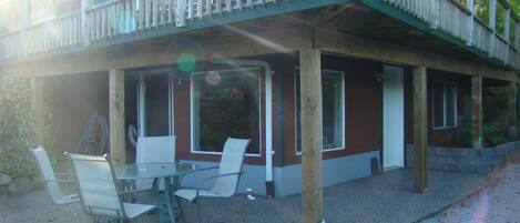 Patio to entrance door and sliding doors in living room