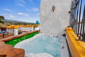 Rooftop hot tub allows you to literally soak up the stunning views!