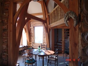 Dining room with loft and winding stair to tower