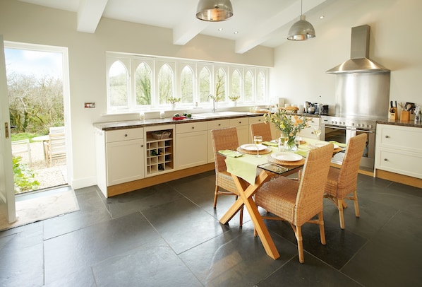 Spacious and fully equipped kitchen and dining table seating four guests