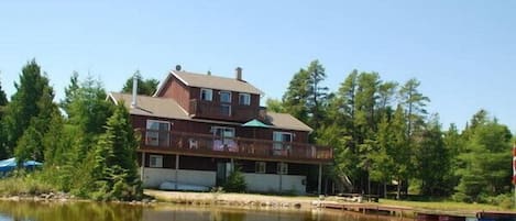 View from the lake looking toward cottage and lakeside.