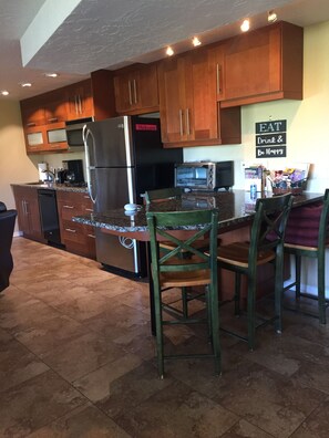Elite appliances, kitchen needs, dinning area, big new TV Wifi Google