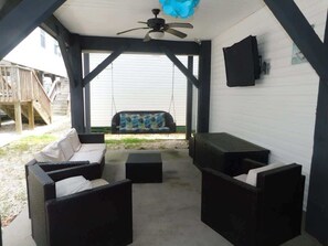 Sitting area under home with tv