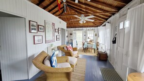 Comfortable sitting area with dining area beyond